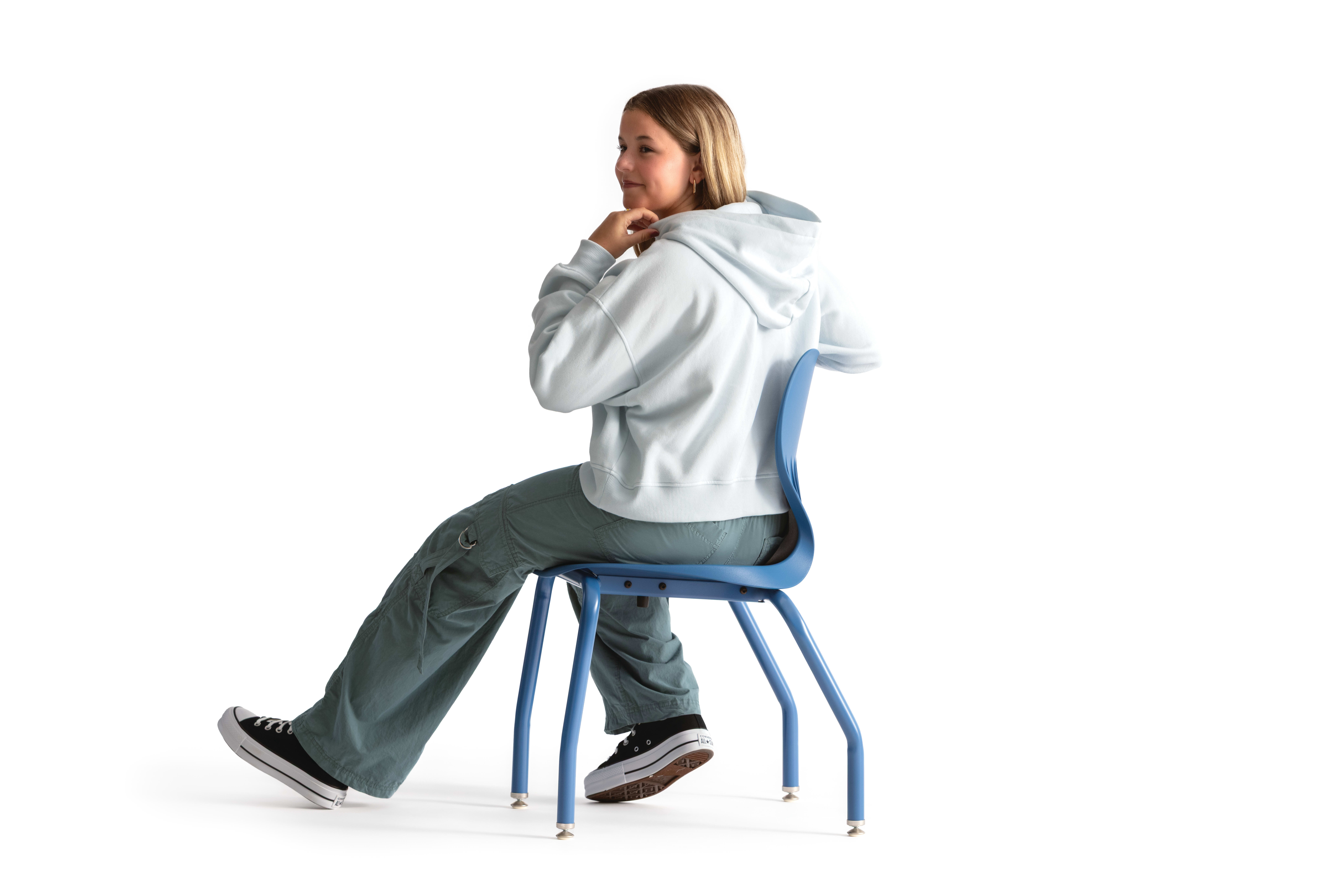 One seated student on a blue monotone Smartlink chair. One seated student on a blue monotone Smartlink chair. One seated student on a blue monotone Smartlink chair. One seated student on a blue monotone Smartlink chair. One seated student on a blue monoto