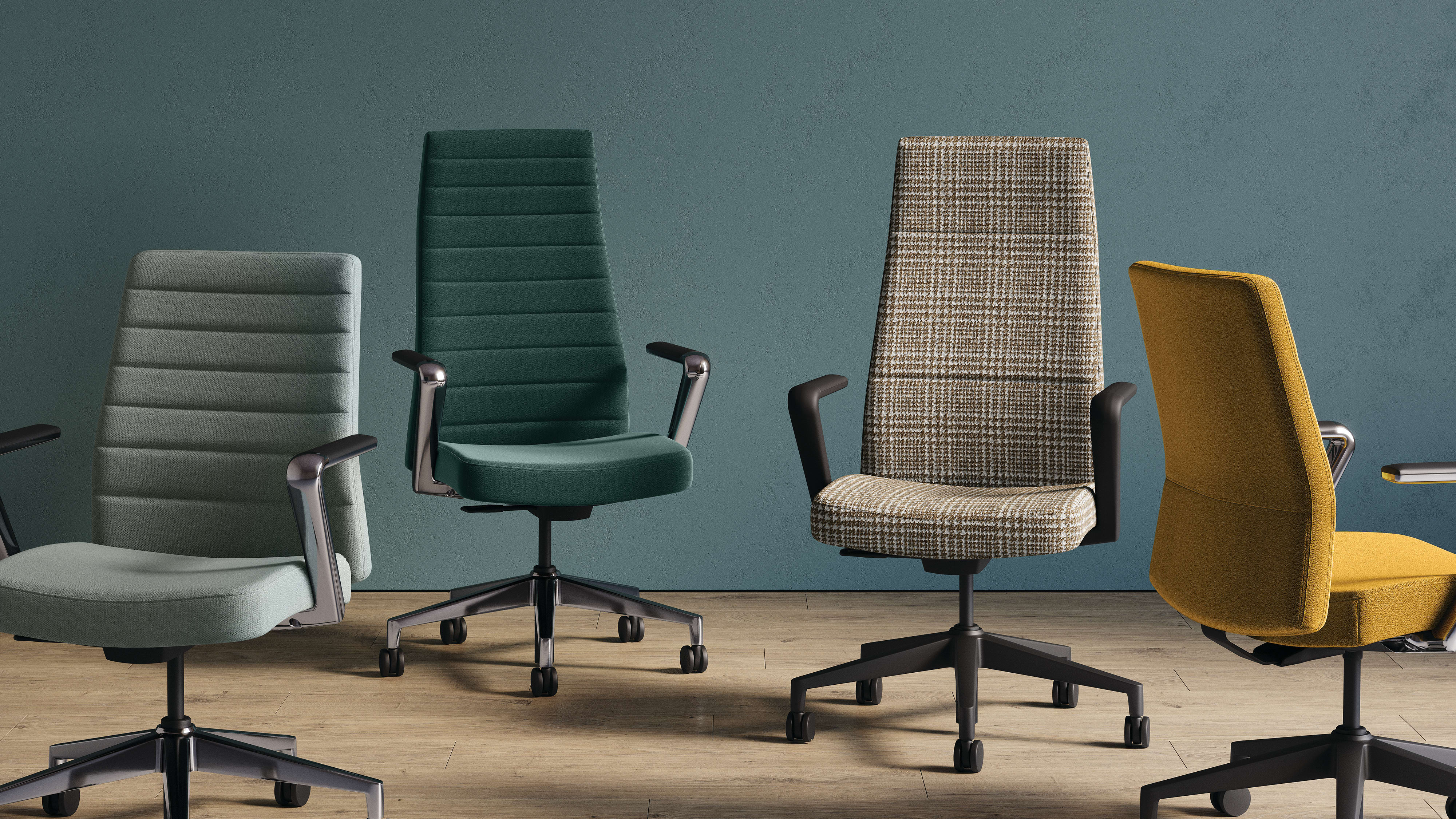 The image depicts several office chairs of various colors and designs, including gray, green, and patterned, arranged in a row on a wooden floor against a teal-colored wall.