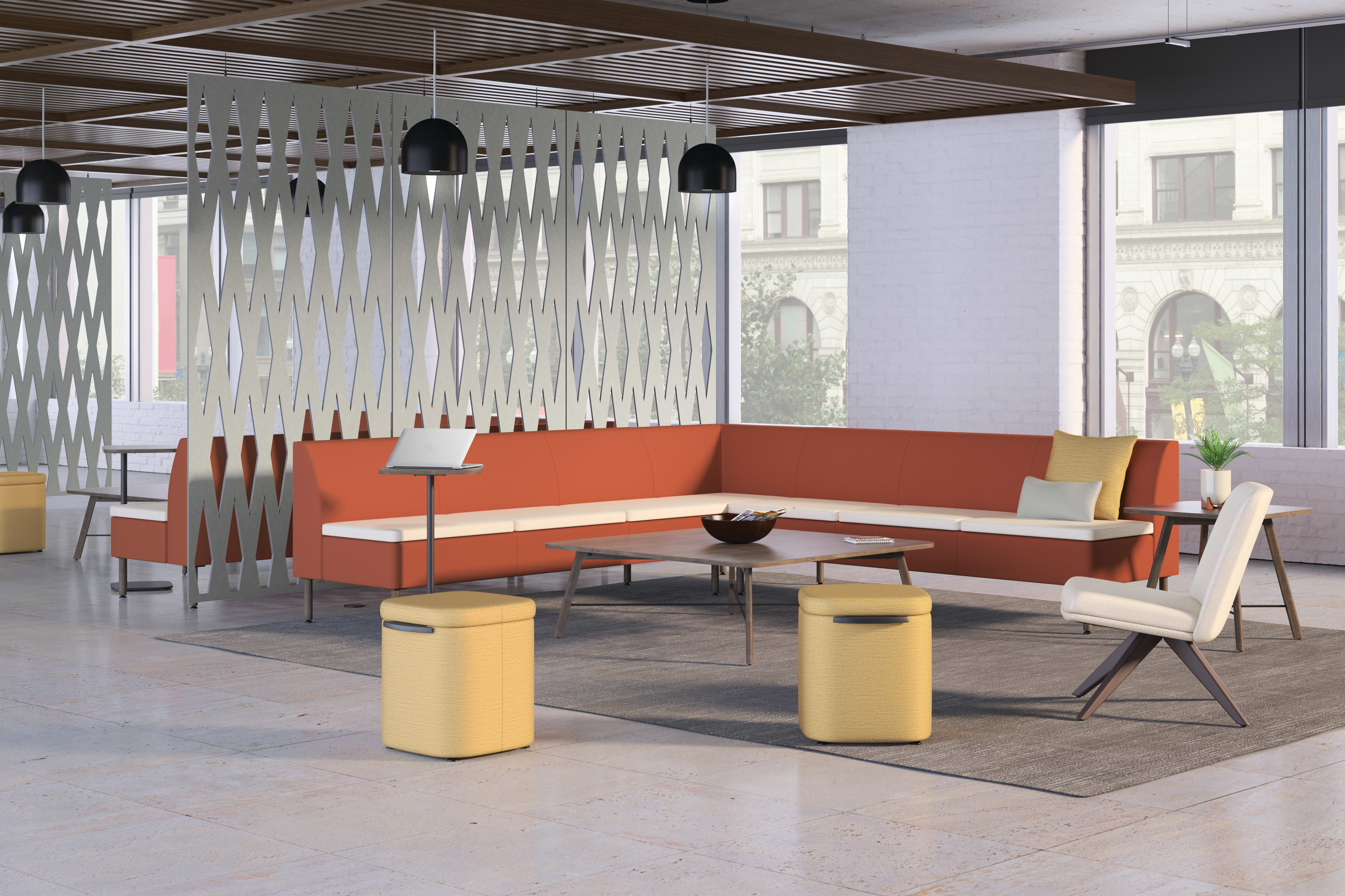 A modern and stylish office space with an orange sectional sofa, wooden accents, and a unique lighting fixture creating a visually interesting and inviting atmosphere.
