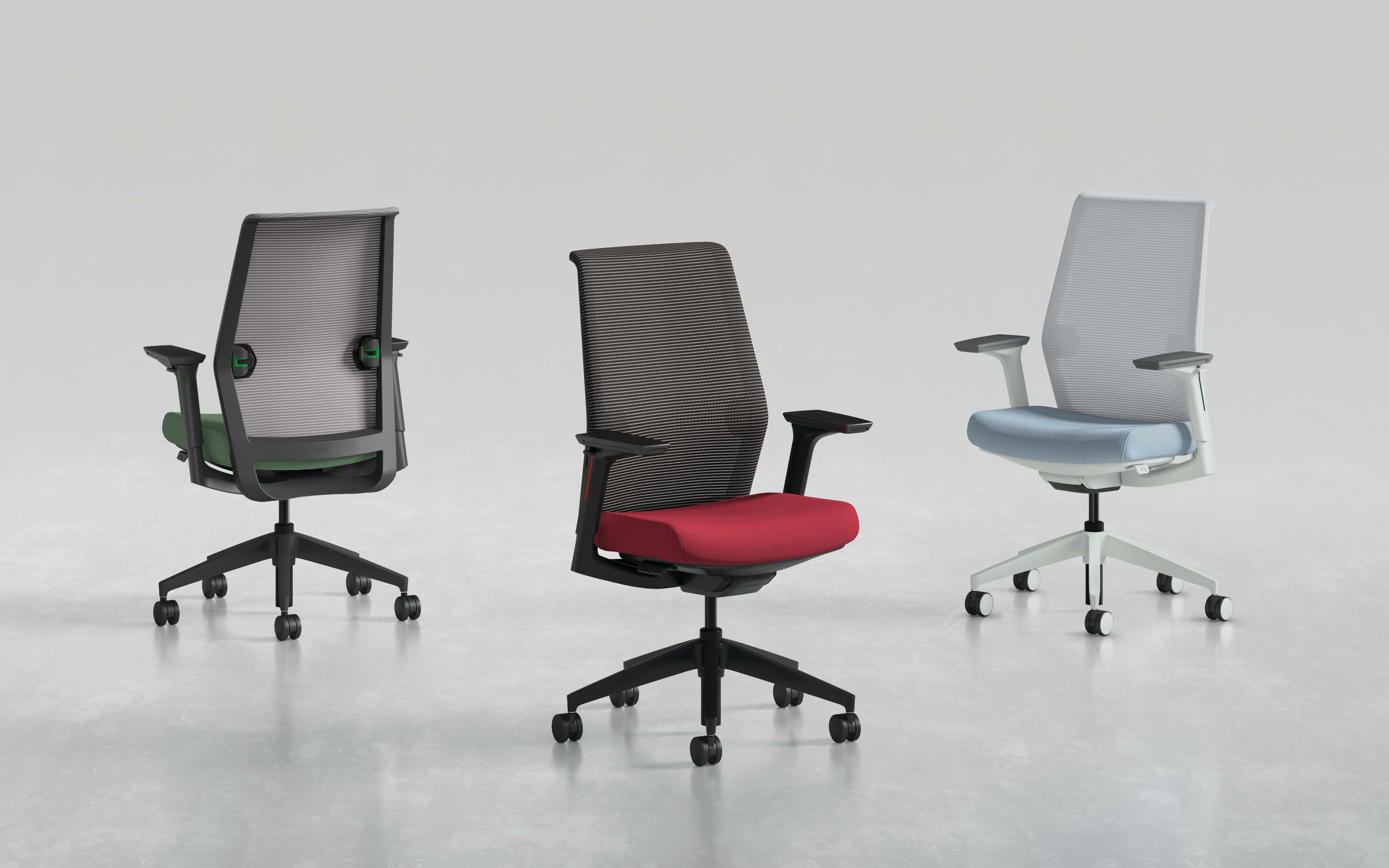 Three modern office chairs with different designs and colors, including black, red, and gray, are displayed on a plain white background.