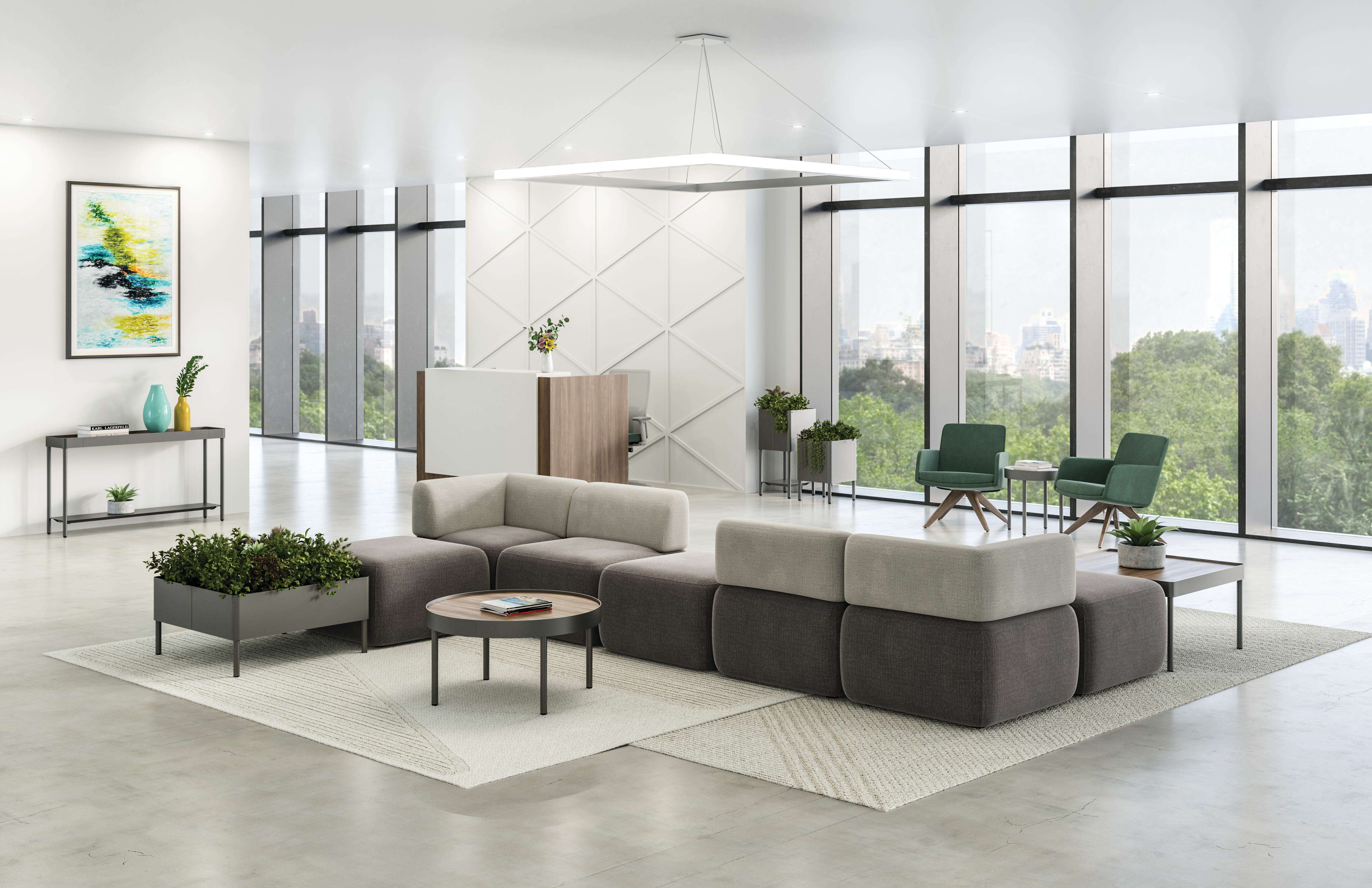 SoCo multi-fabric modular lounge in reception area with Sculpt occasional tables & planters near 10500 Series station and Mav seating.