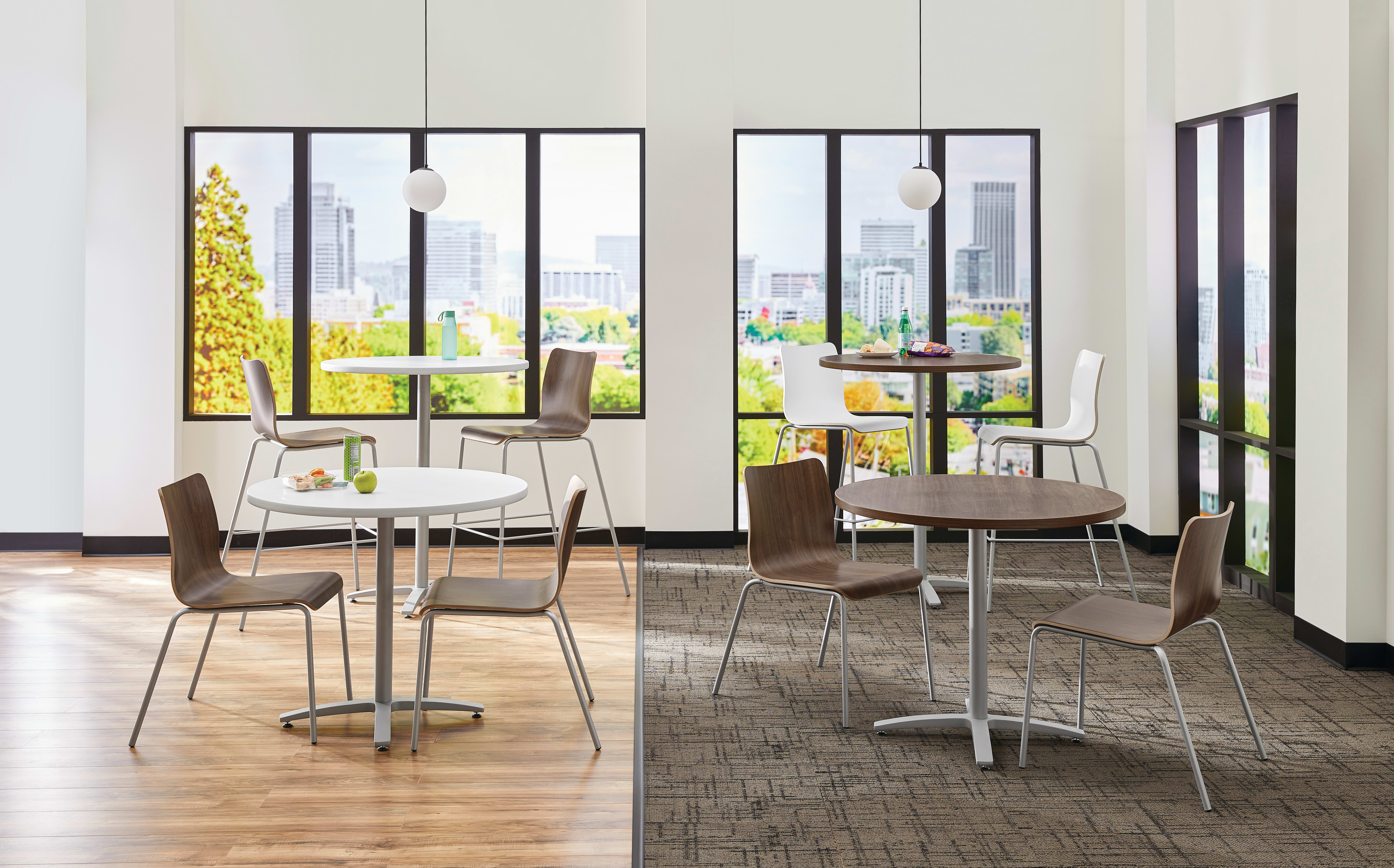 Between Standing and seated height tables with Ruck chairs in a café area