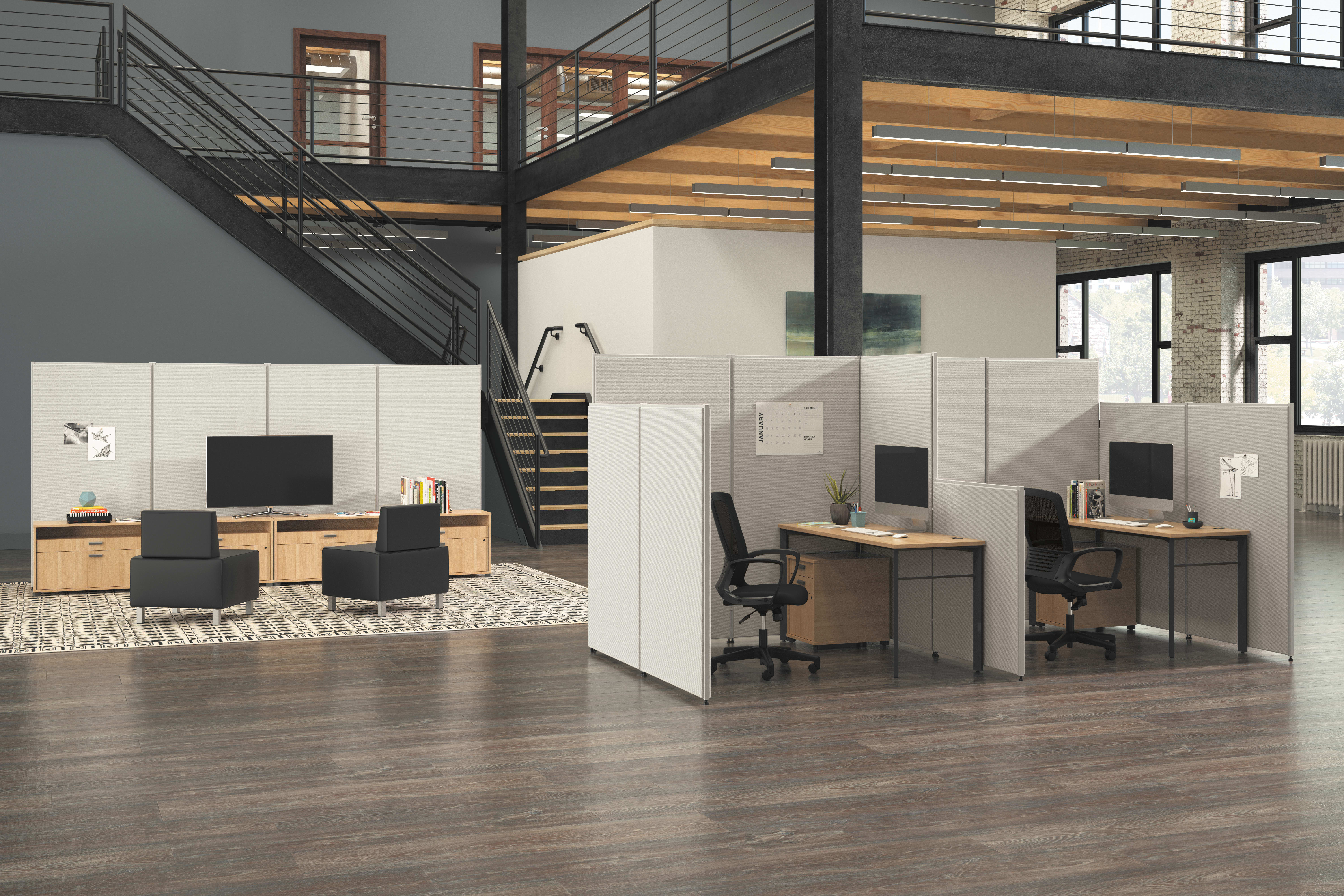 A modern, open-concept office space with a loft-style layout, featuring a mix of workstations, storage units, and a staircase leading to an upper level.