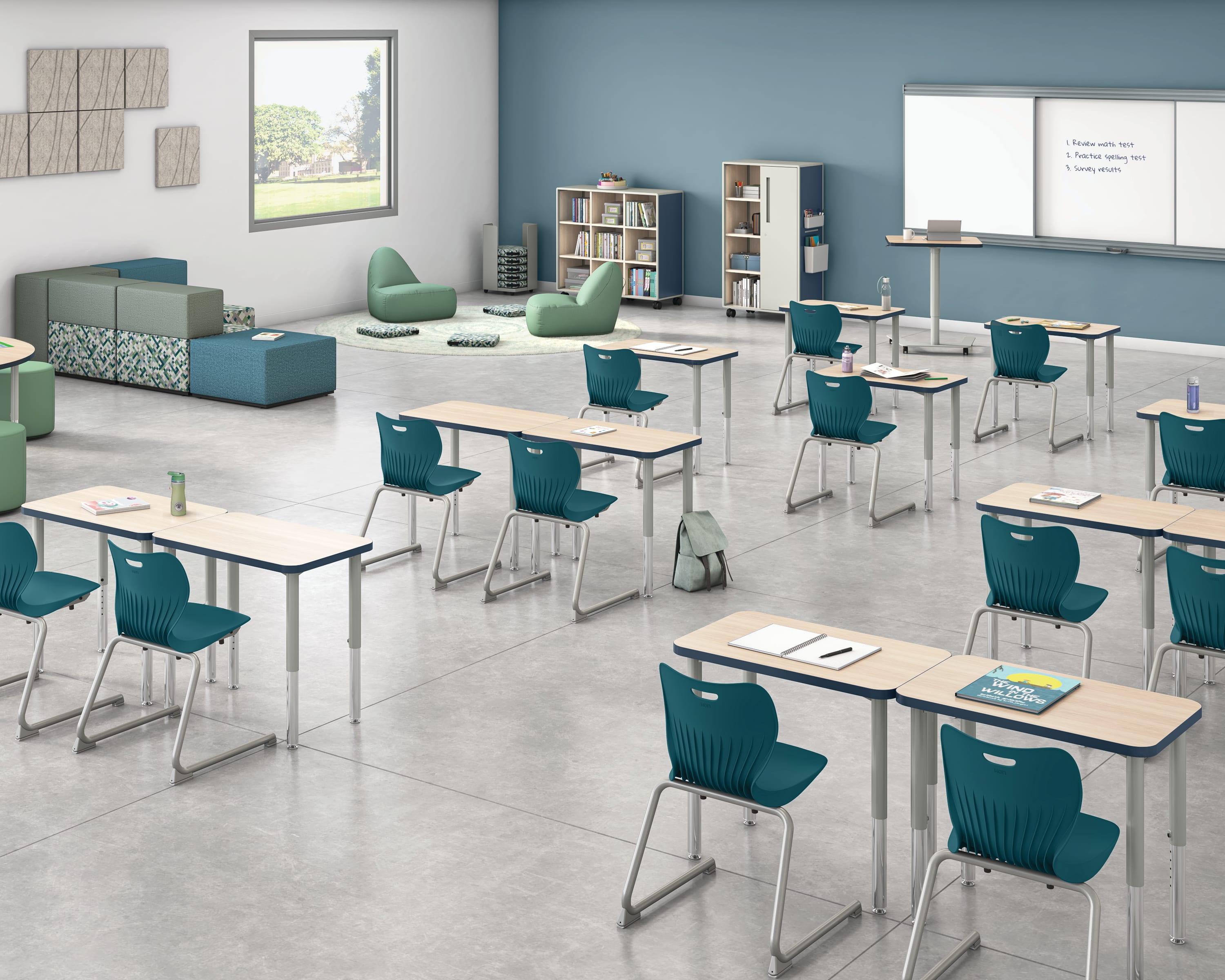 Classroom with flexible Build student desks, blue student chairs, and green soft seating.