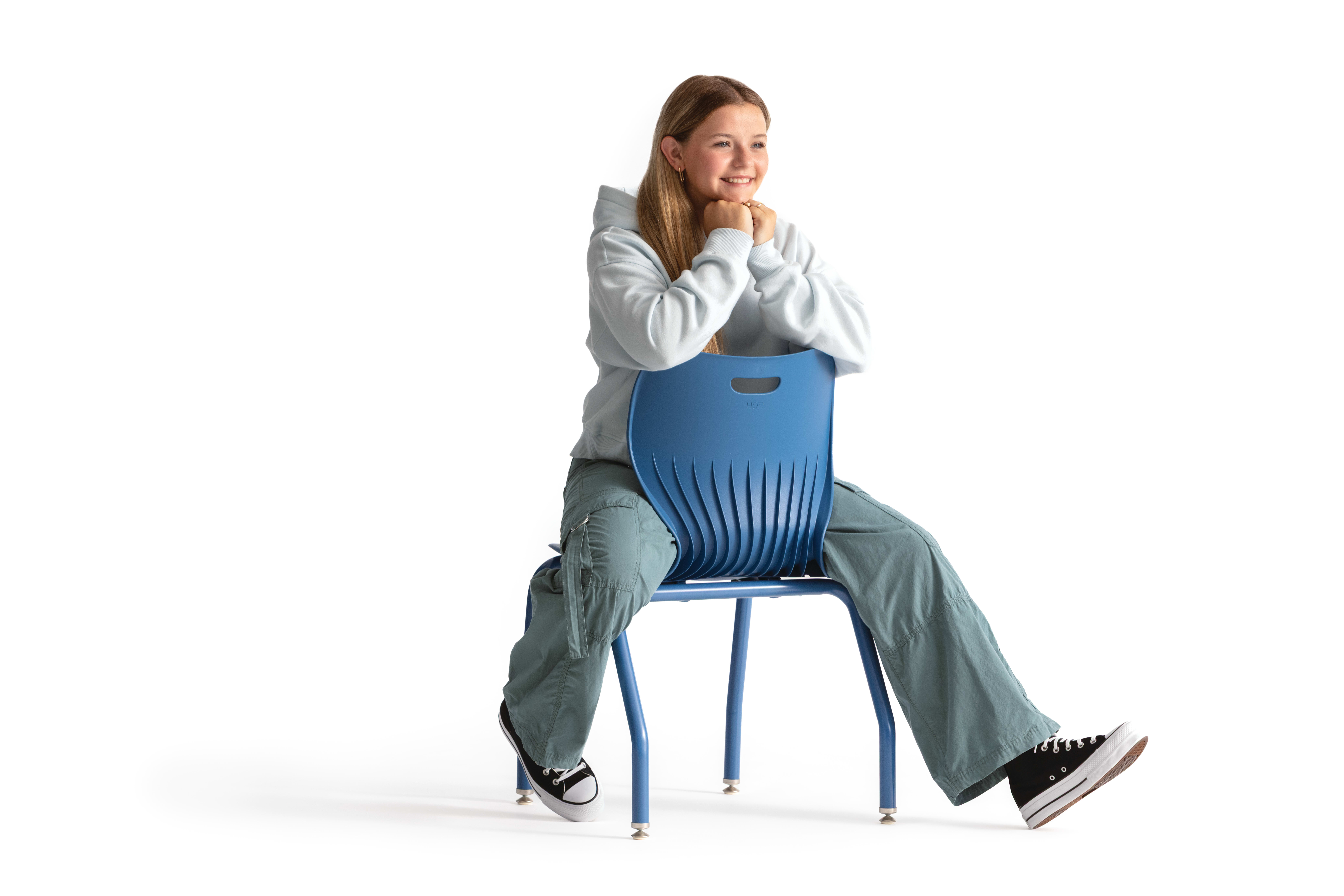 One seated student on a blue monotone Smartlink chair. One seated student on a blue monotone Smartlink chair. One seated student on a blue monotone Smartlink chair. One seated student on a blue monotone Smartlink chair. One seated student on a blue monoto