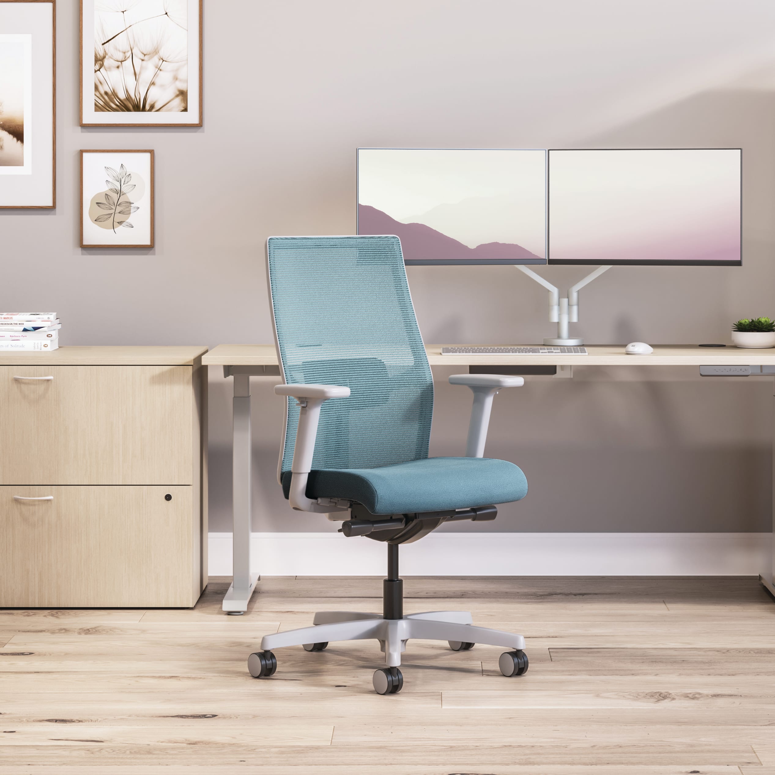 Private office featuring Mod desk with height adjustable table and Ignition task seating in blue fabric.