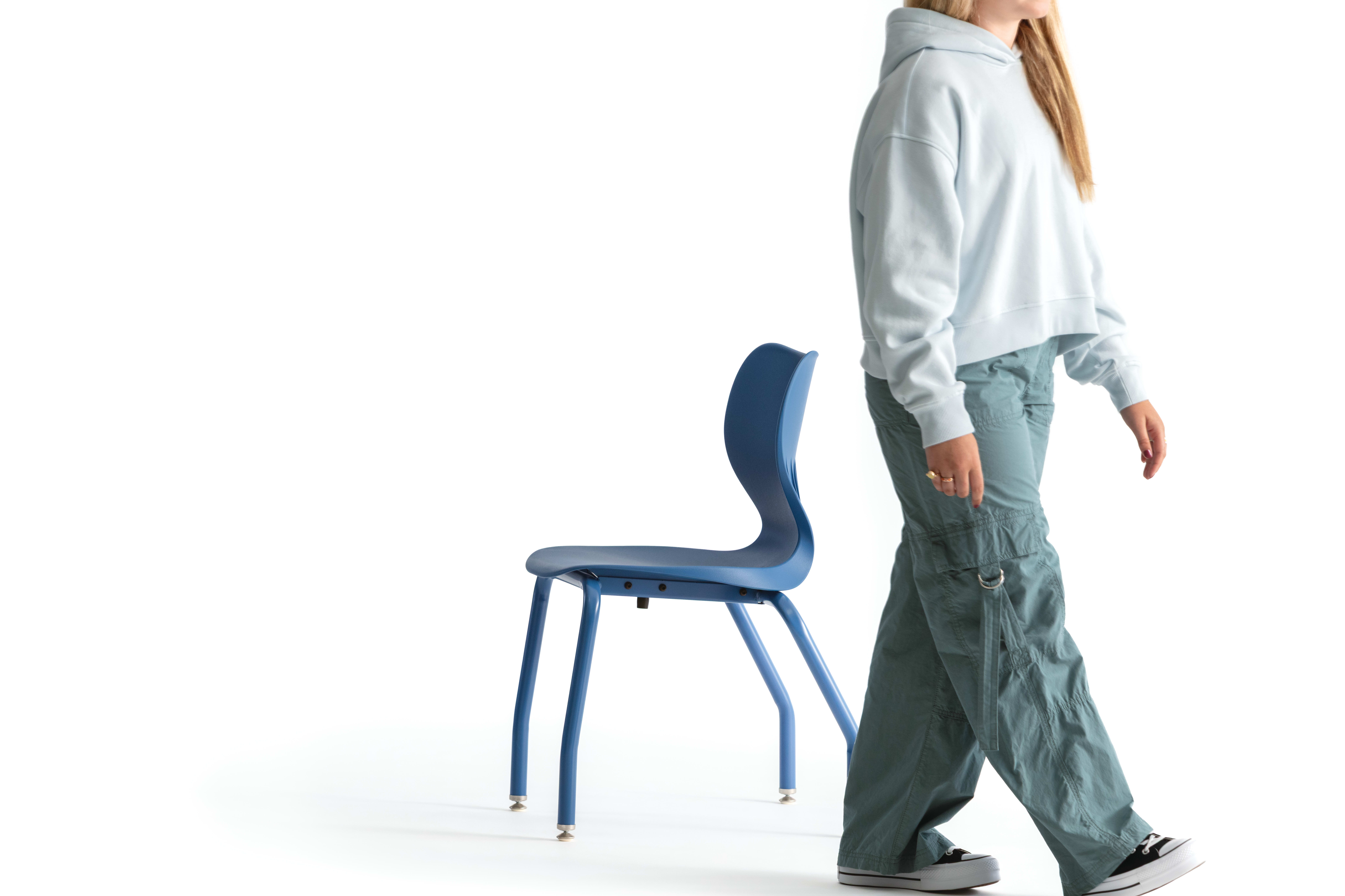 One seated student on a blue monotone Smartlink chair. One seated student on a blue monotone Smartlink chair. One seated student on a blue monotone Smartlink chair. One seated student on a blue monotone Smartlink chair. One seated student on a blue monoto