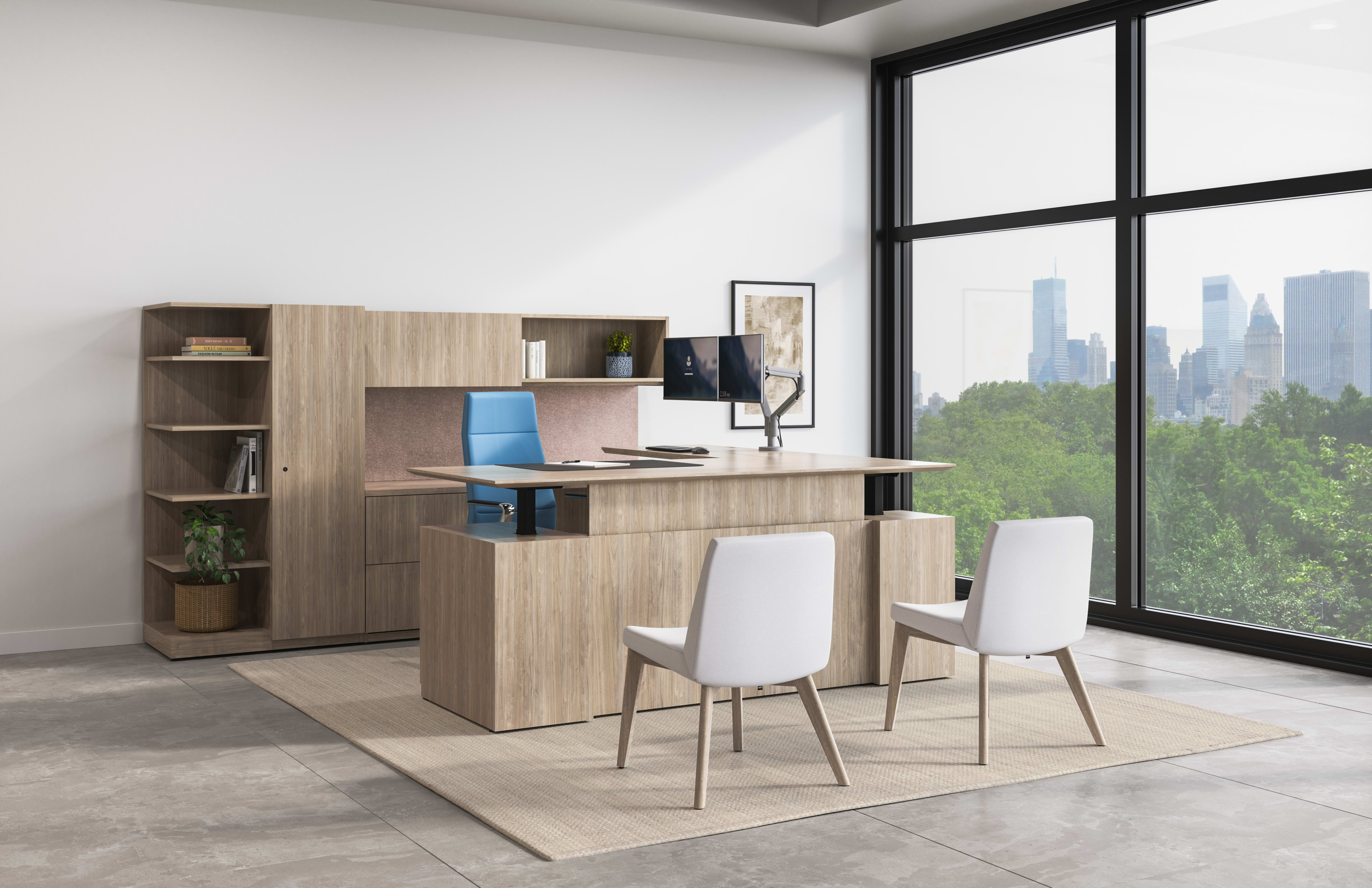 Concinnity Height-Adjustable L Desk in light laminate with flock guest chairs in light fabric in a private office with a wall of windows.