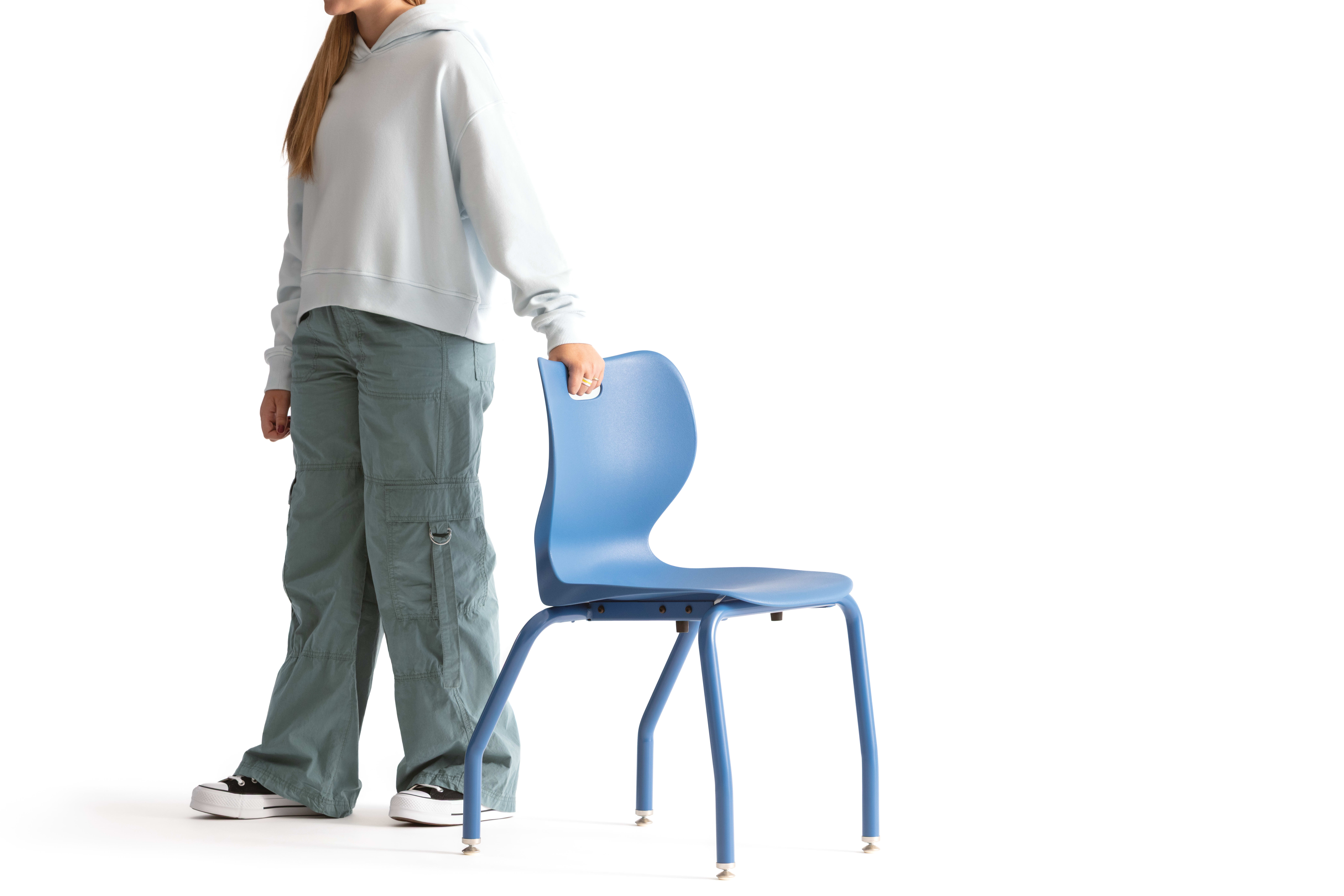 One seated student on a blue monotone Smartlink chair. One seated student on a blue monotone Smartlink chair. One seated student on a blue monotone Smartlink chair. One seated student on a blue monotone Smartlink chair. One seated student on a blue monoto