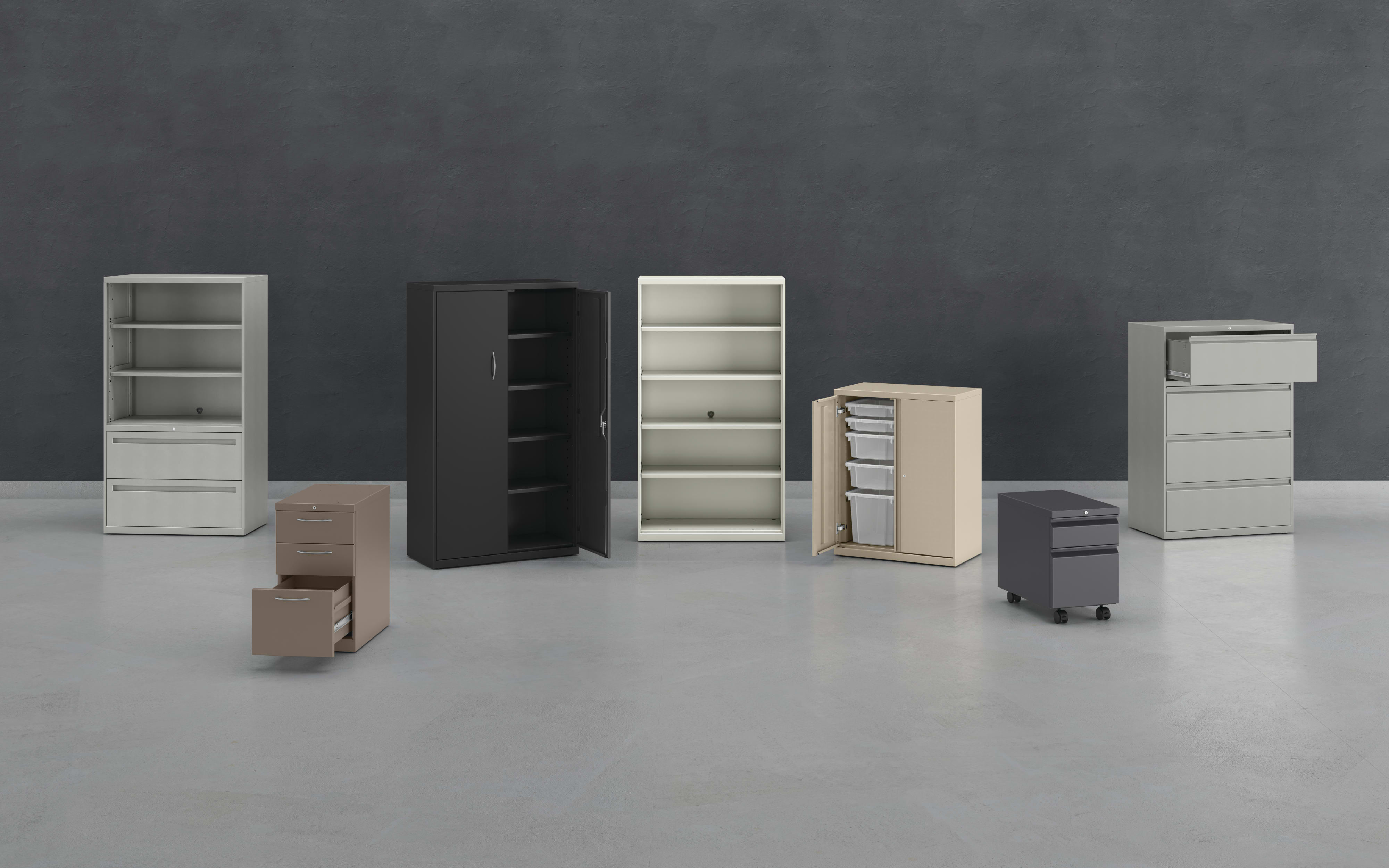 Various office furniture pieces, including shelves, cabinets, and drawers, are arranged on a plain gray background.