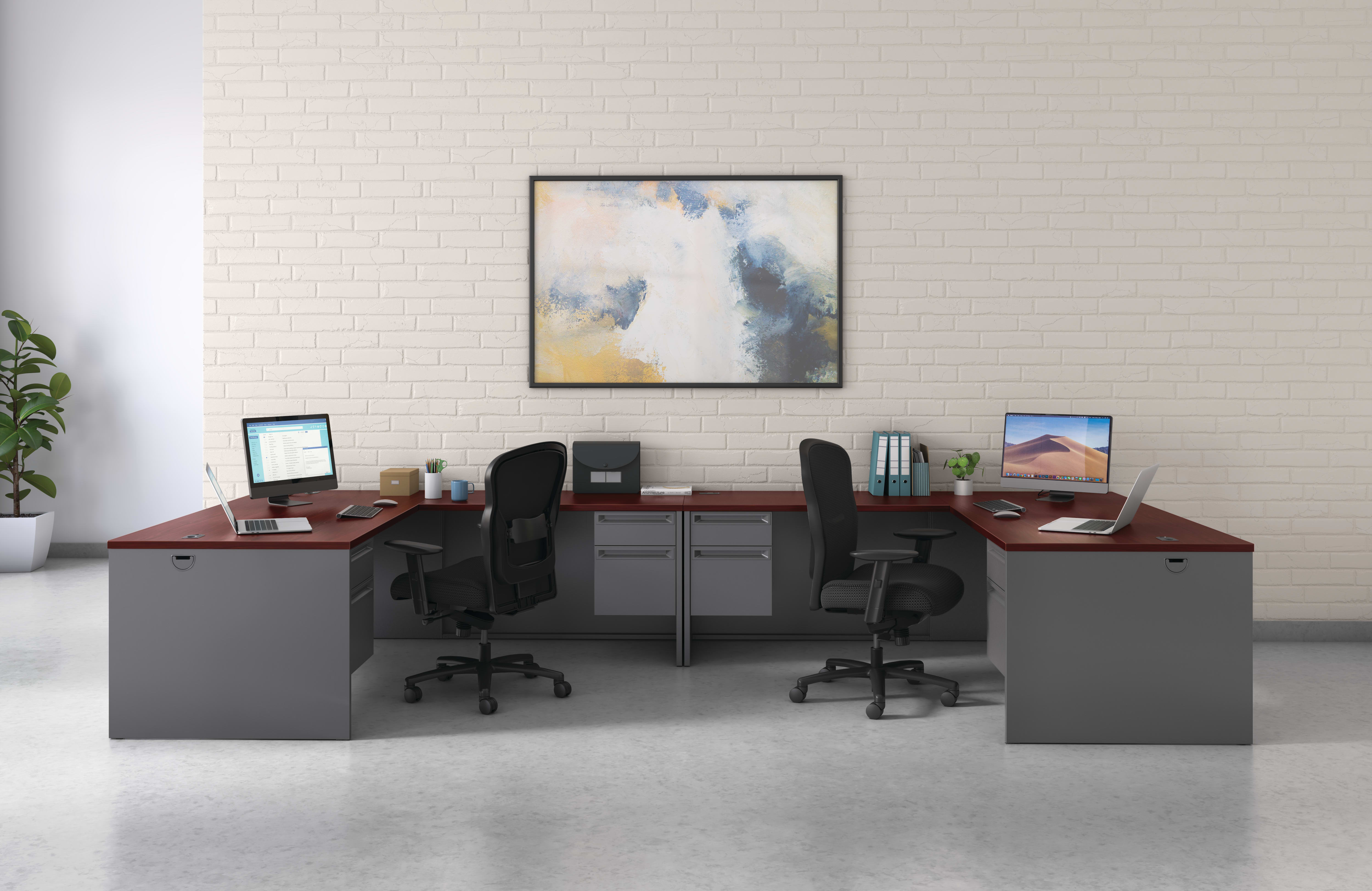 A modern and minimalist office space with two desks, chairs, computers, and a framed abstract artwork on the wall.