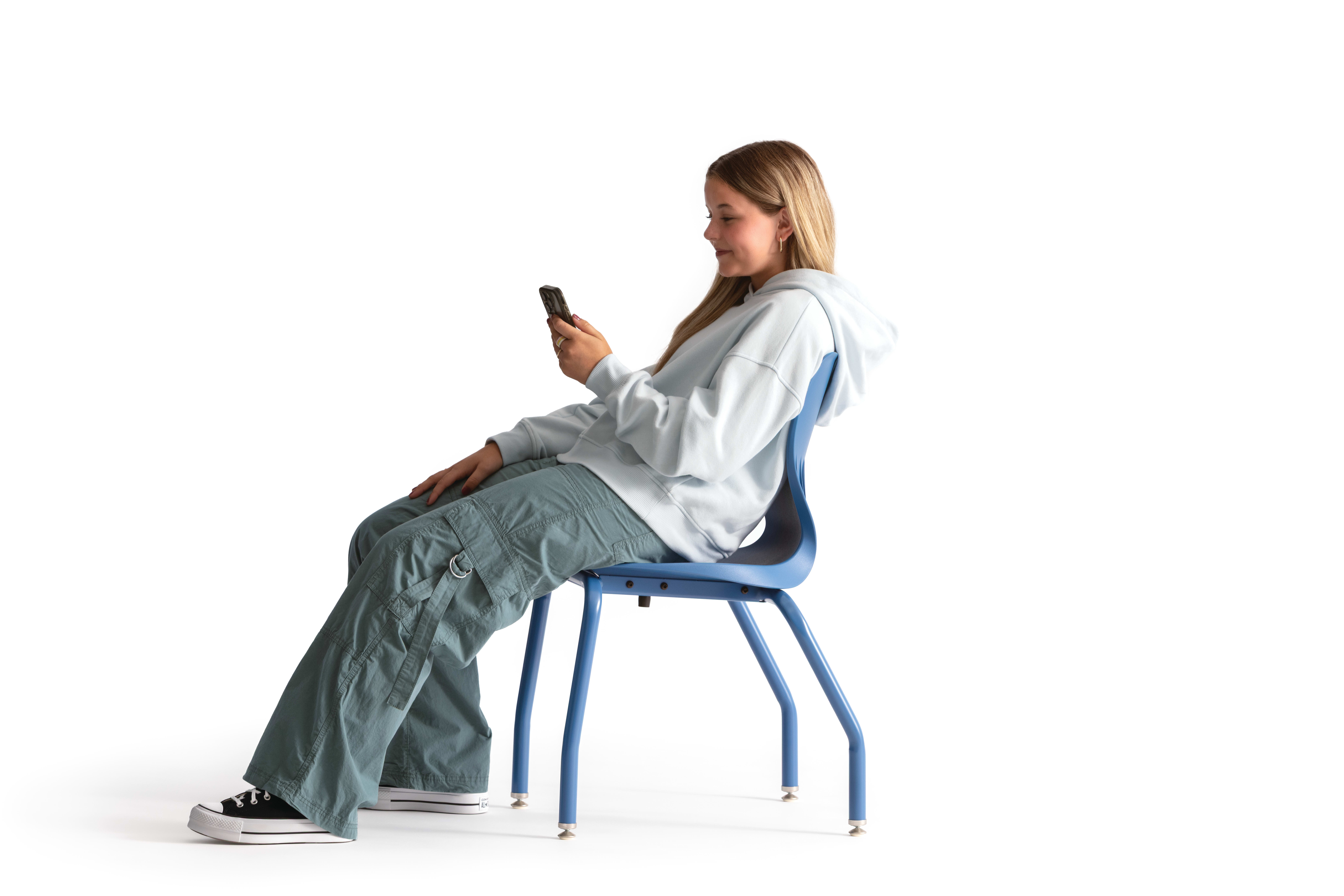 One seated student on a blue monotone Smartlink chair. One seated student on a blue monotone Smartlink chair. One seated student on a blue monotone Smartlink chair. One seated student on a blue monotone Smartlink chair. One seated student on a blue monoto