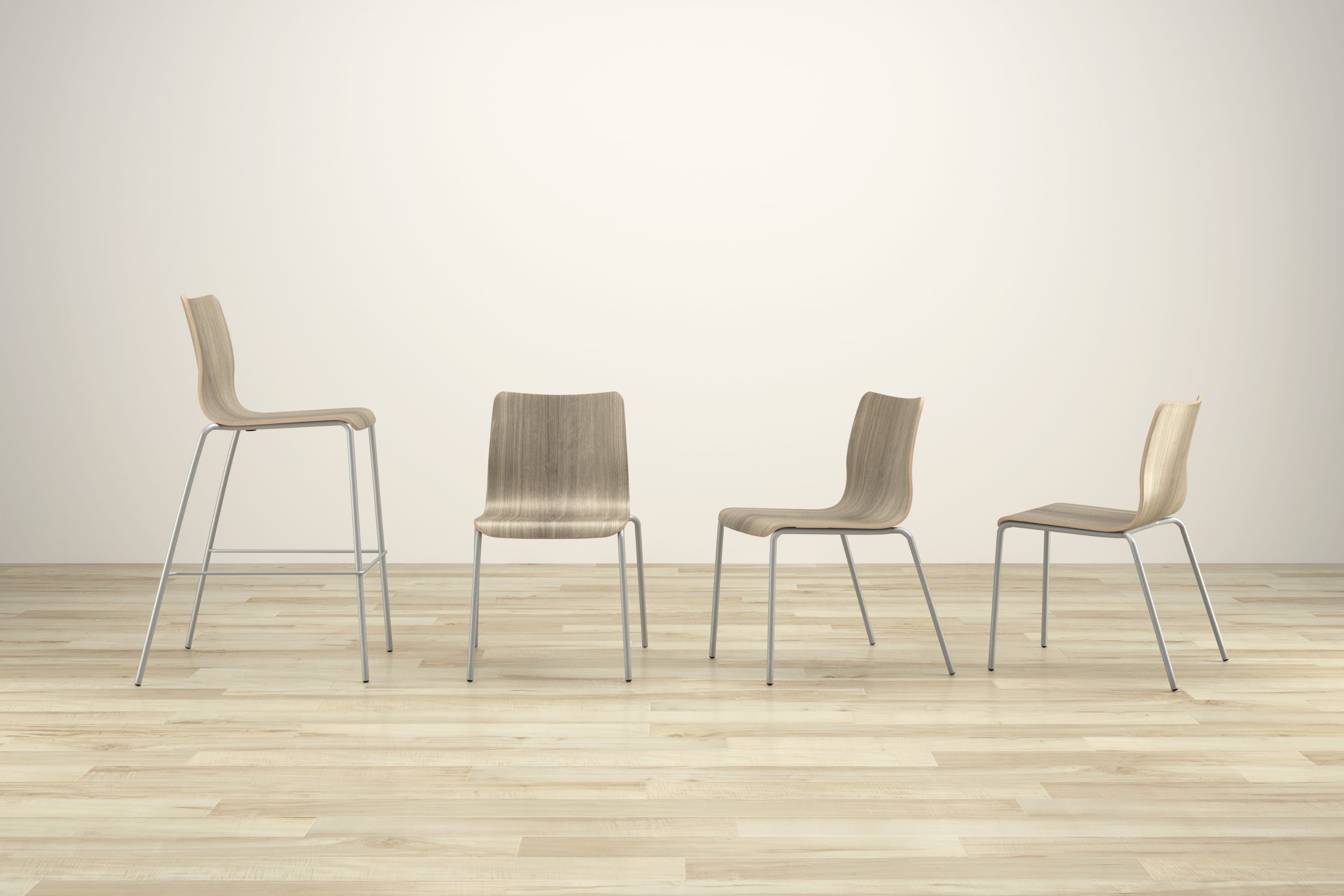 Four modern, minimalist chairs of various shapes and sizes are arranged on a wooden floor against a plain white background.