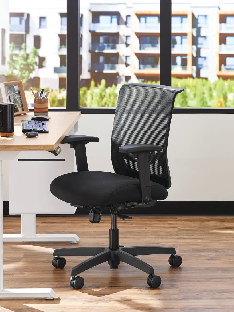 Two white Coordinate Height-Adjustable Bases paired with Coze desk tops and Convergence Task chairs in a small office setting