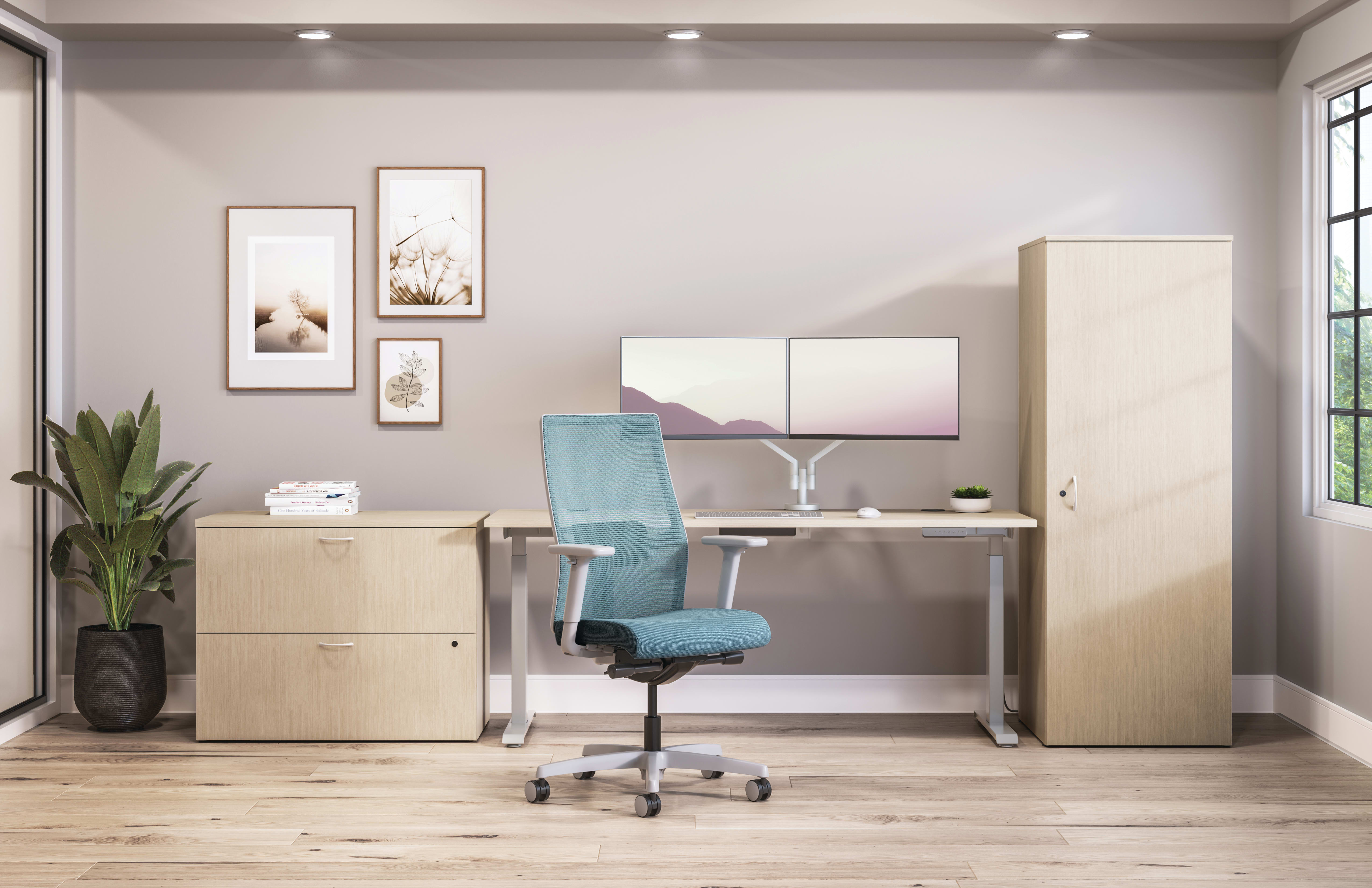 Private office featuring Mod desk with height adjustable table and Ignition task seating in blue fabric.