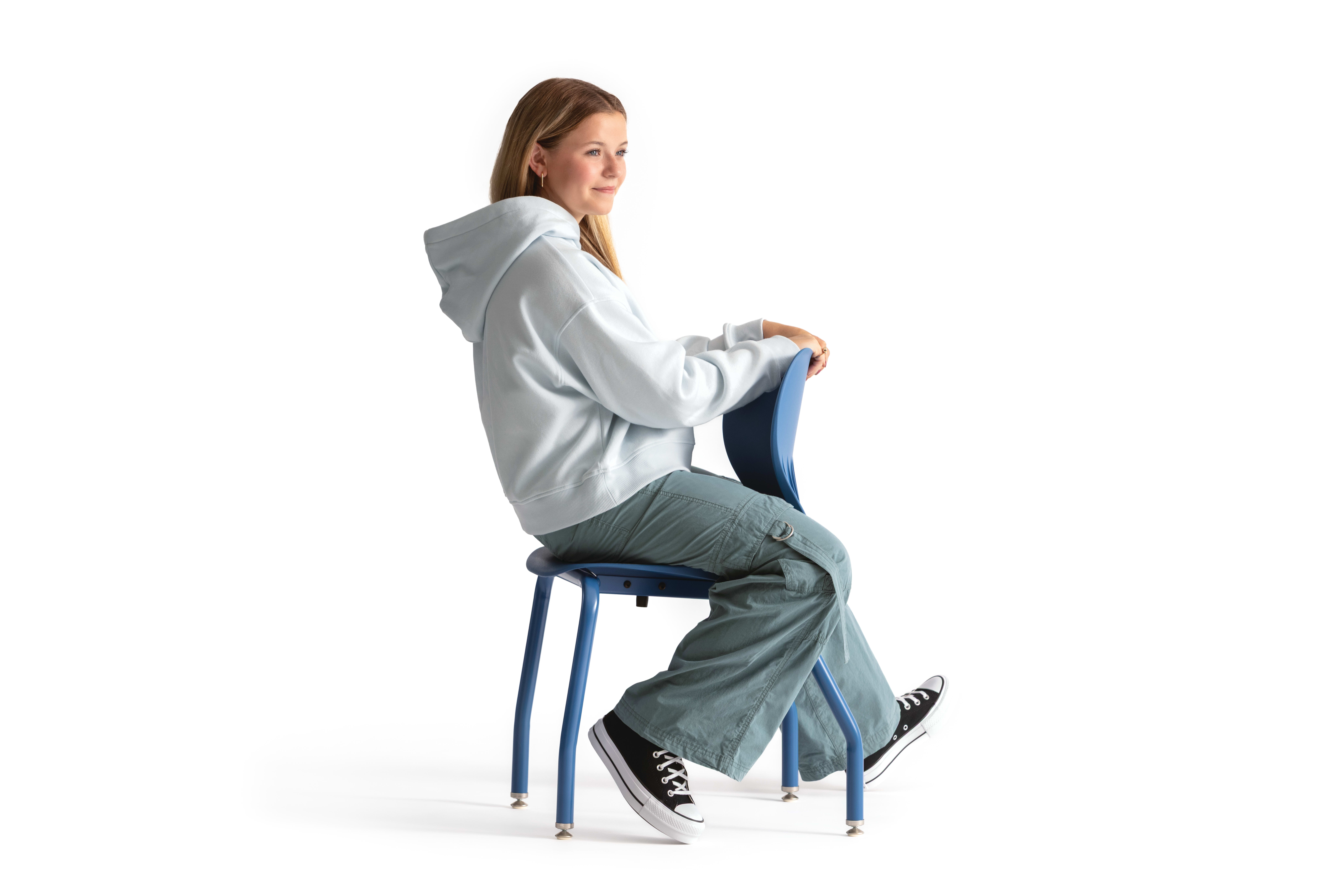 One seated student on a blue monotone Smartlink chair. One seated student on a blue monotone Smartlink chair. One seated student on a blue monotone Smartlink chair. One seated student on a blue monotone Smartlink chair. One seated student on a blue monoto