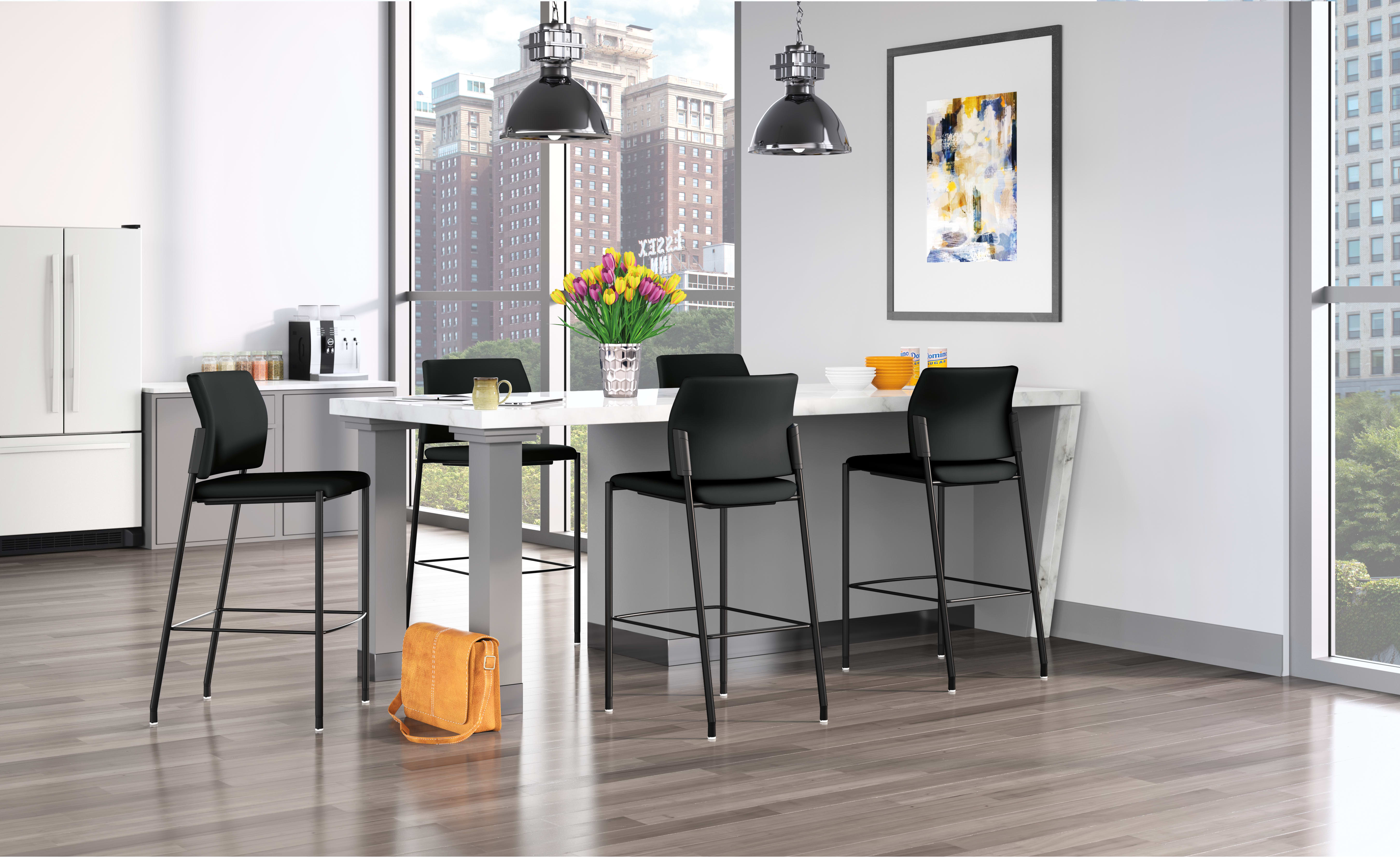 A modern and stylish dining area with a white table, black bar stools, and large windows overlooking a cityscape in the background. The room is decorated with a colorful abstract artwork and pendant lighting fixtures.