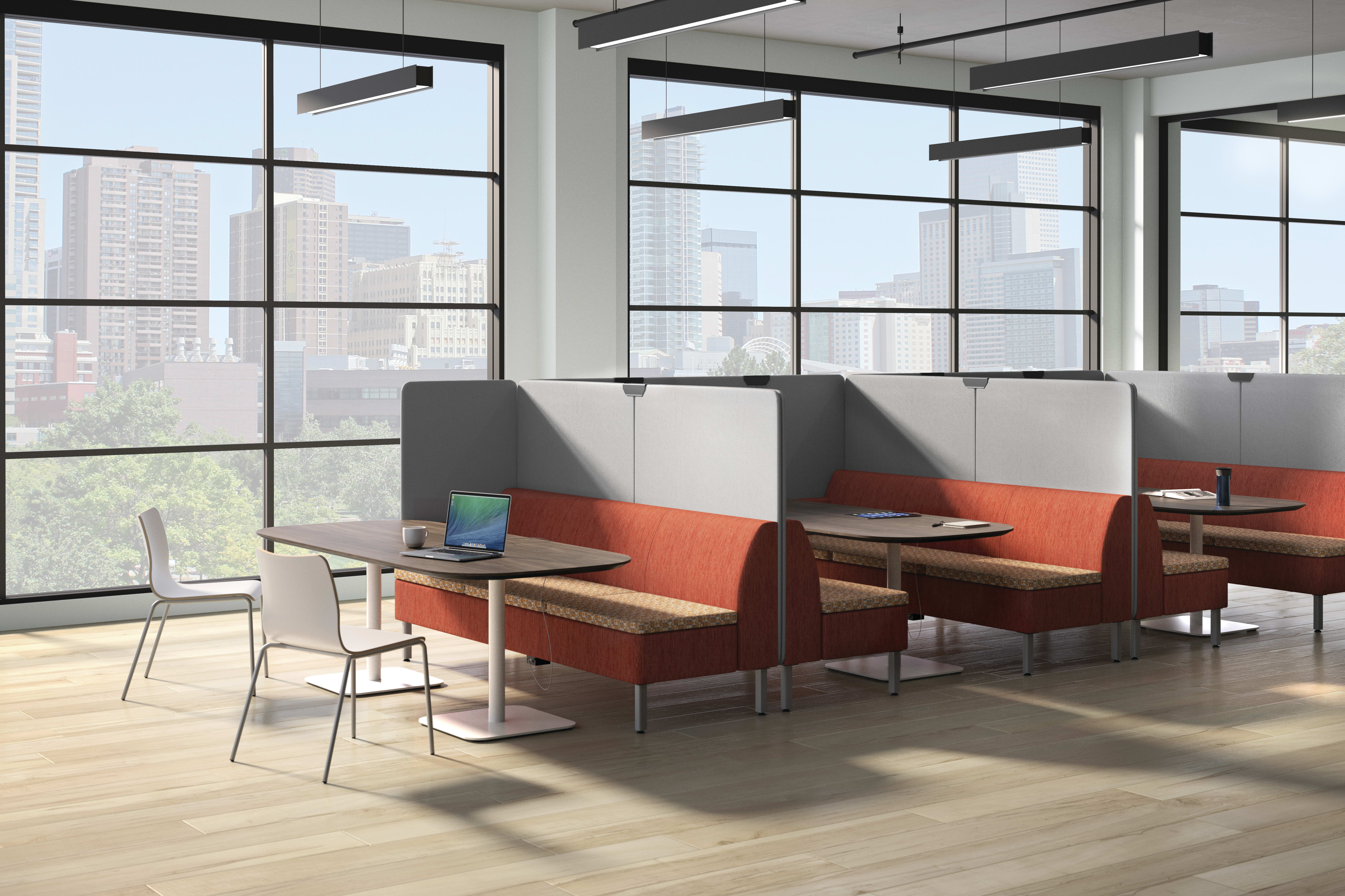 A modern office space with large windows overlooking a cityscape, featuring comfortable seating arrangements and a minimalist design aesthetic.