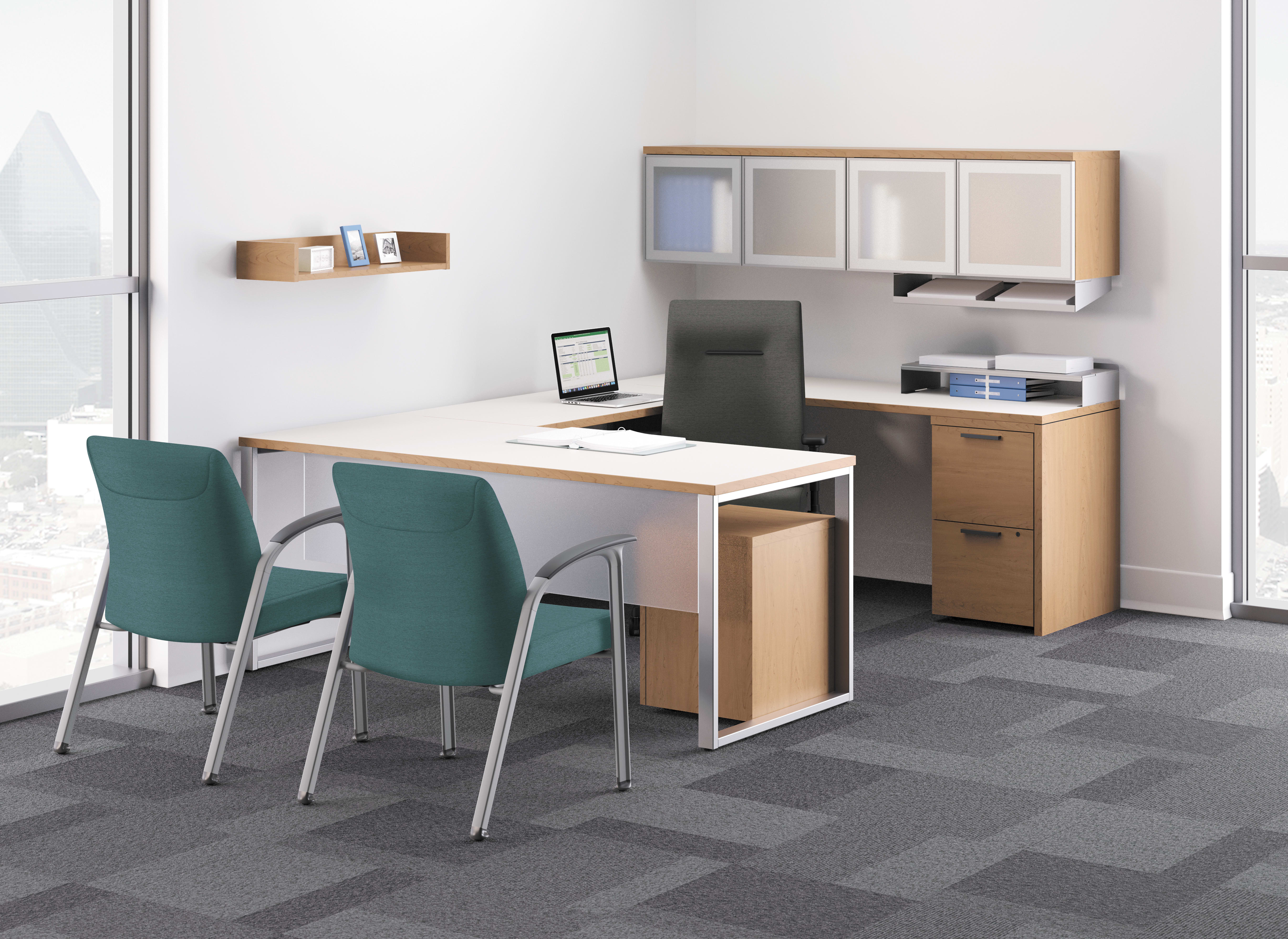 A modern and minimalist office space with a wooden desk, green chairs, and various storage units and shelves on the walls.