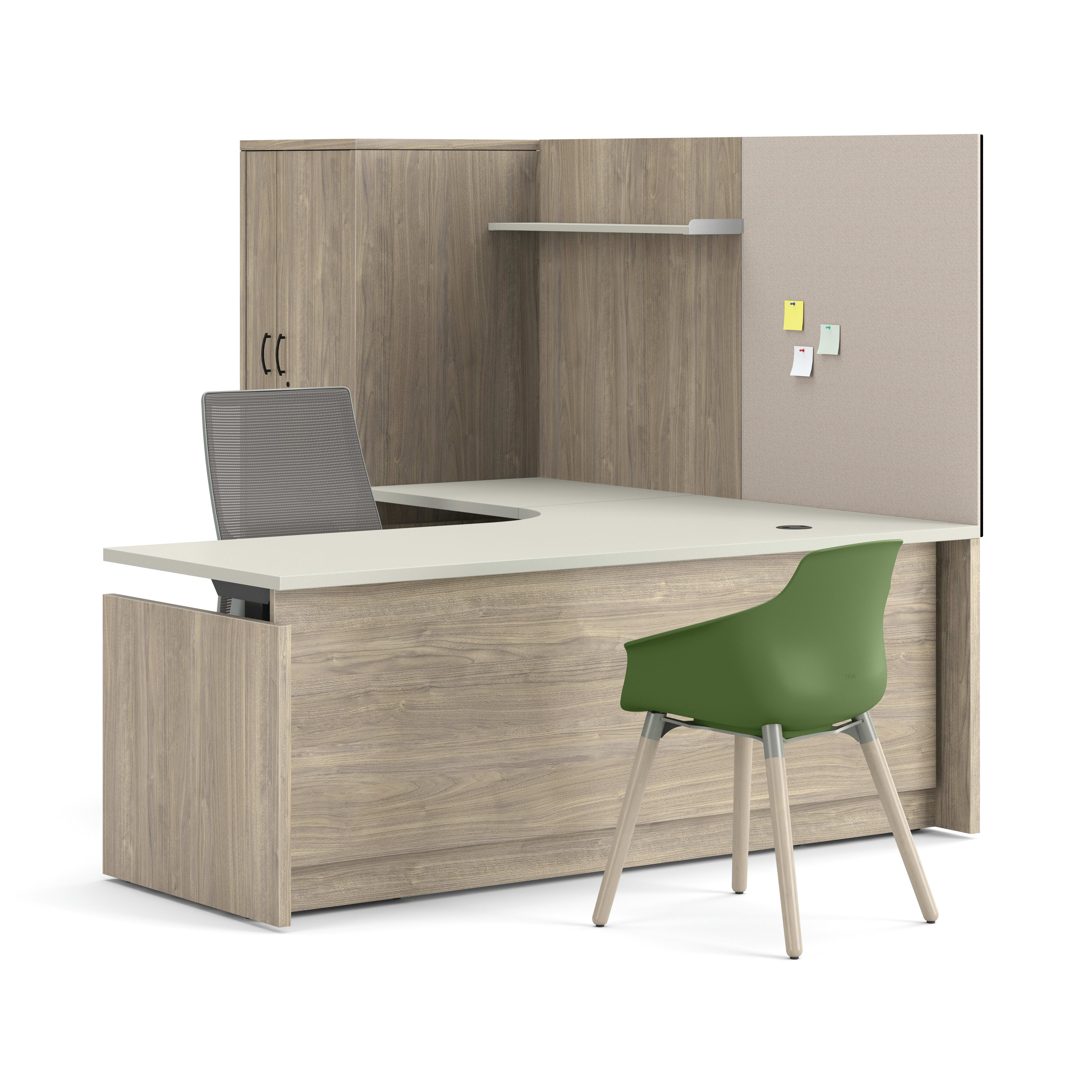 Contemporary U-shaped office workstation with overhead storage cabinet, privacy panel, mesh task chair, and green guest chair.