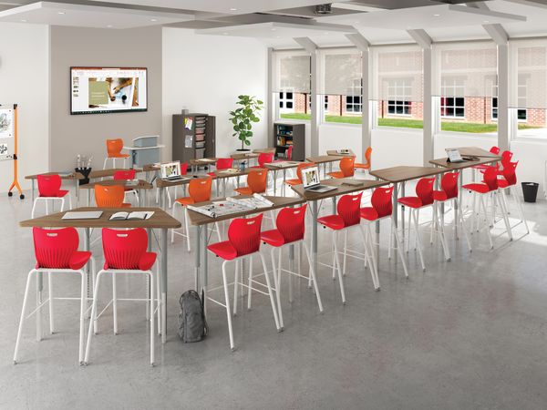 Classroom showing tiered desking with Build tables and desks and SmartLink chairs and Smartlink stools.