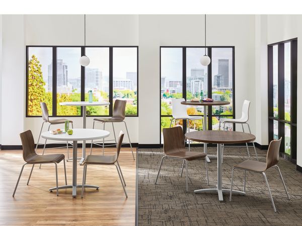 Between Standing and seated height tables with Ruck chairs in a café area