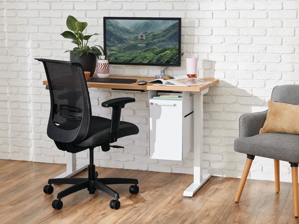 Two white Coordinate Height-Adjustable Bases paired with Coze desk tops and Convergence Task chairs in a small office setting