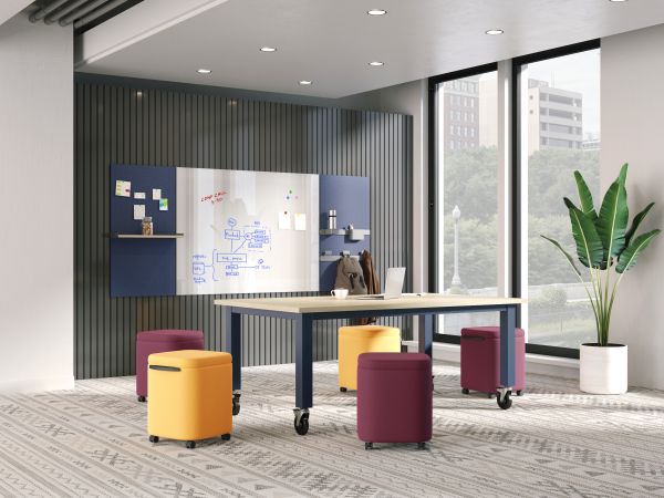 Preside table with Astir poufs with Workwall tiles in open collaborative setting