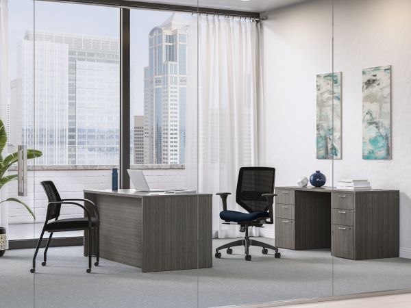 Mod executive desk in Slate Teak with Solve task chair and Ignition guest chair
