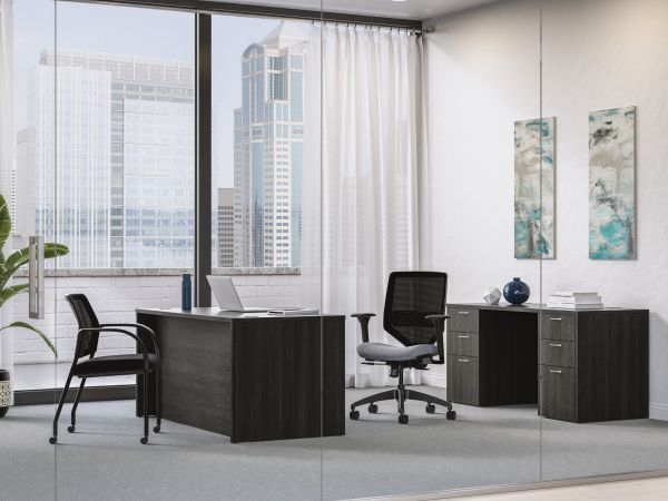 Mod executive desk in Java Oak with Solve task chair and Ignition guest chair