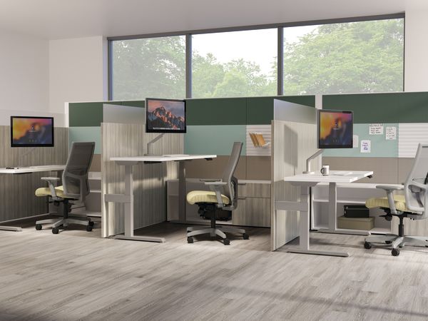 Three Abound workstations with a variety of tile options in an open plan area.