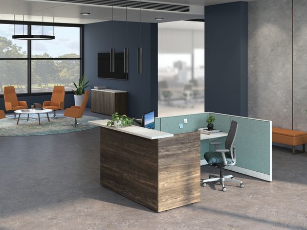 Accelerate welcoming reception station across from waiting area featuring Mav lounge chairs.