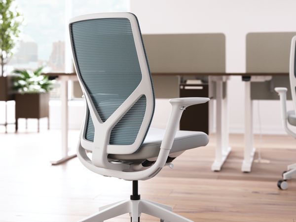 Flexion task chair with height adjustable workstations in background.