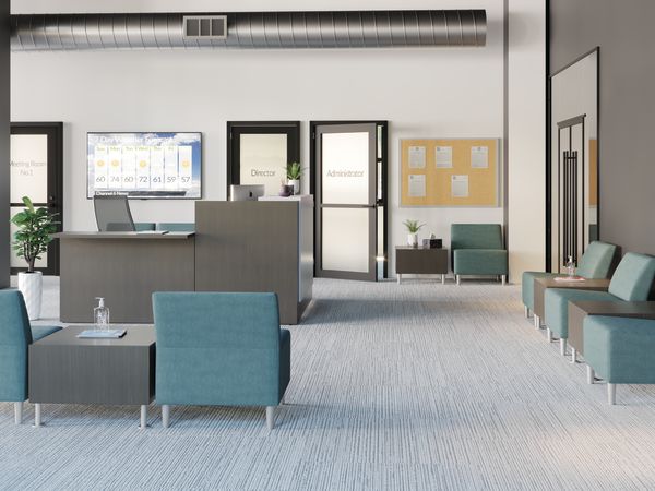 A modern and minimalist office space with a reception area, comfortable seating, and various decor elements such as plants and artwork.