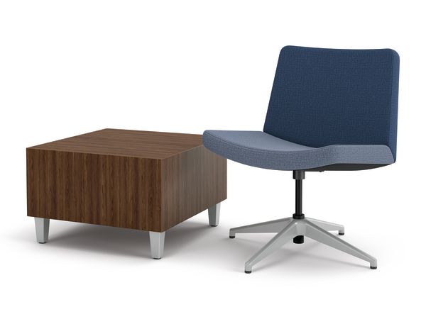 Flock wide lounge next to cube table.