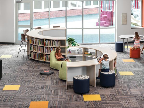 Storyline Bookcases and Bistro Tables with Confetti Floor Cushions and Lounges, and Flock Minis.
