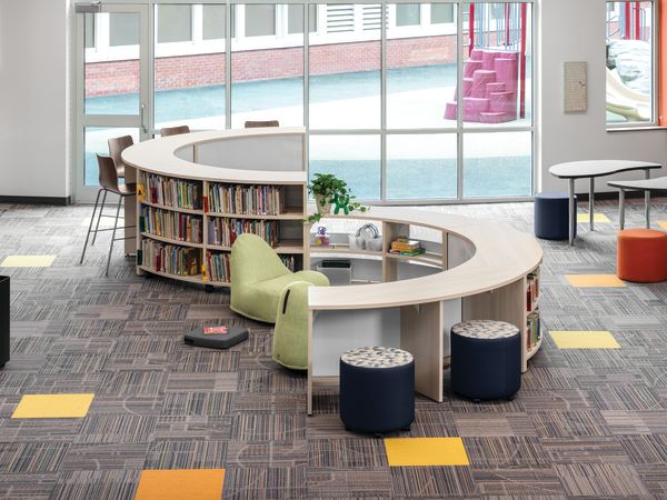 Storyline Bookcases and Bistro Tables with Confetti Floor Cushions and Lounges, and Flock Minis.