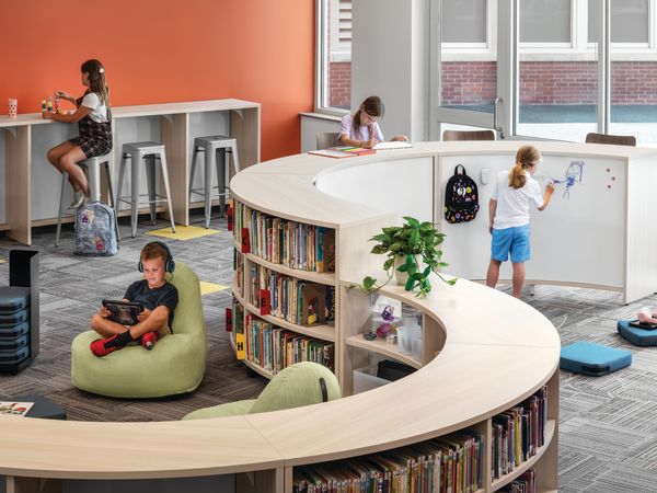 Storyline Bookcases and Bistro Tables with Confetti Floor Cushions and Lounges.