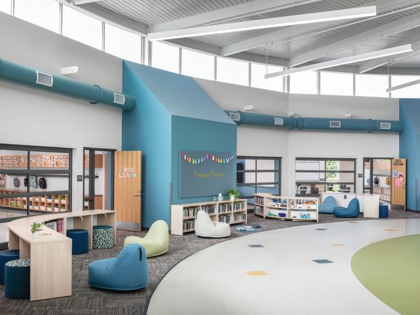 Storyline Bookcases and Bistro Tables with Confetti Floor Lounge and Flock Minis.