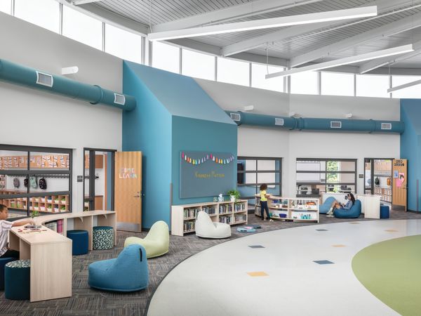 Storyline Bookcases and Bistro Tables with Confetti Floor Lounge and Flock Minis.