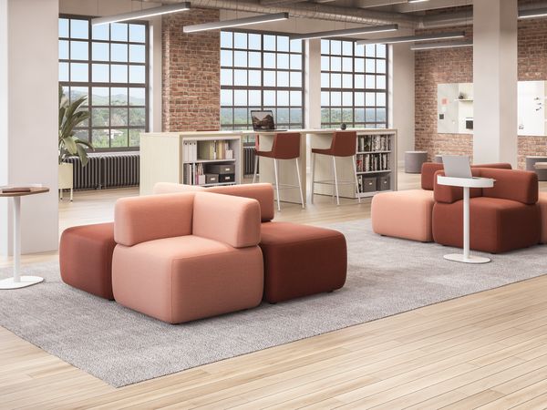 SoCo modular lounge in collaborative area with Sculpt personal tables & planter near Storage Island.