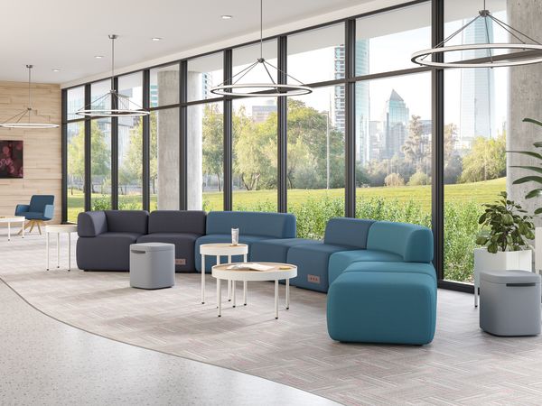 SoCo modular lounge in public space with Sculpt occasional tables & planters and Astir poufs.