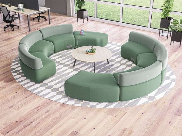 SoCo multi-fabric modular lounge in collaborative area with Scramble table and Sculpt planters near Empower workstations.