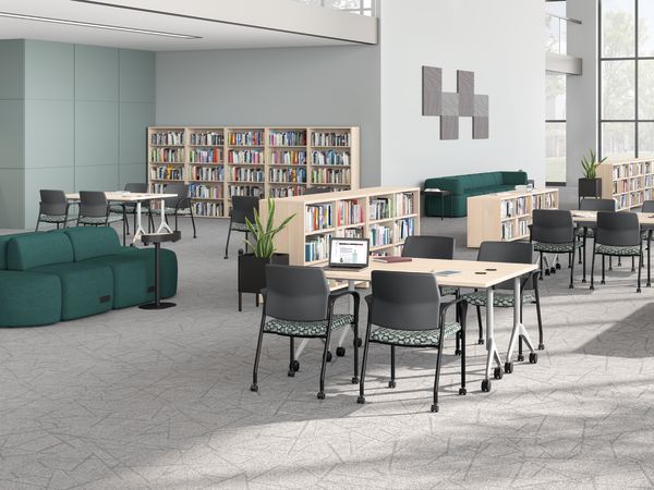 A multi-media center setting featuring SoCo seating, Ignition guest chairs, and Motivate tables.