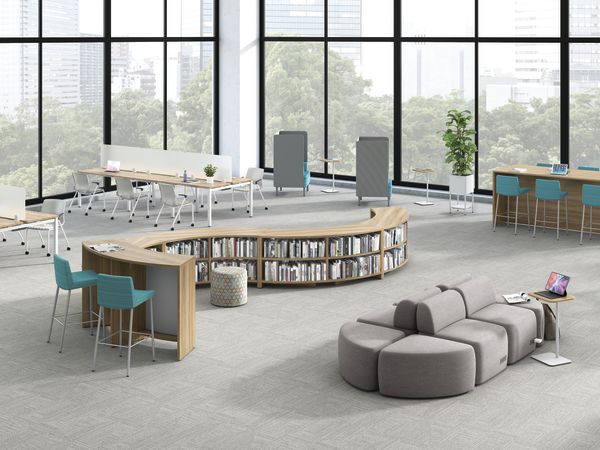 A multi-media center setting featuring Storyline bookcases, SoCo seating, and Empower benching.