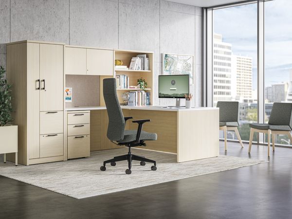 10500 Series traditional executive L-shaped desk with Cofi upholstered high-back chair.