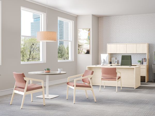 Confer guest chairs with Birk Round Top with Knife Edge and working lounge-height single pedestal.