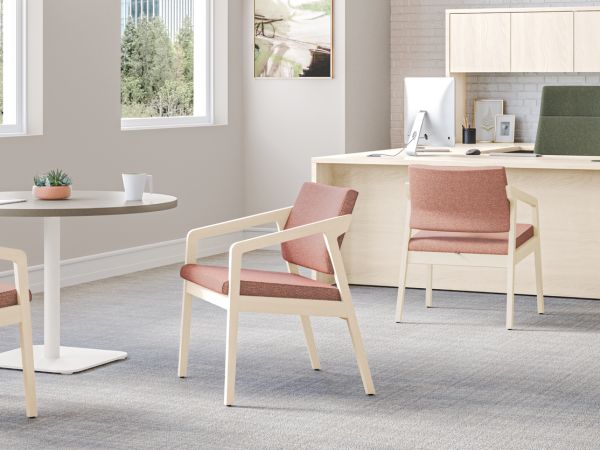 Confer guest chairs with Birk Round Top with Knife Edge and working lounge-height single pedestal.