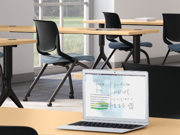 A classroom setting featuring Motivate chairs and tables with SmartLink learning board system.