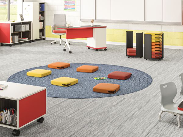 Class-ifi Storage with Confetti Floor Cushions and Storage Cart, Build Tables, Cipher Task Chair, and SmartLink Chairs, Teacher Desk, and Wall Rail System.